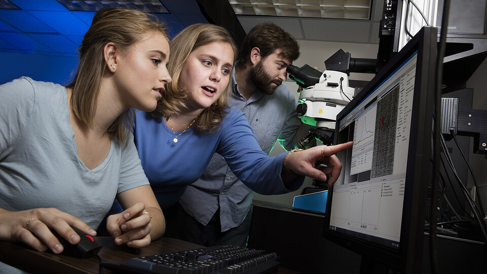 Photo Credit: Nicole Iverson (center), assistant professor of biological systems engineering at Nebraska, works with then-undergraduate Janelle Adams and graduate student Eric Hofferber in August 2016. The Iverson Lab has earned a $1.77 million grant from the Department of Health and Human Services to make nitric oxide sensors easy to use and to utilize them to study both healthy and diseased cells. 